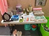 Photo of vendor table displaying miscellaneous items for sale.